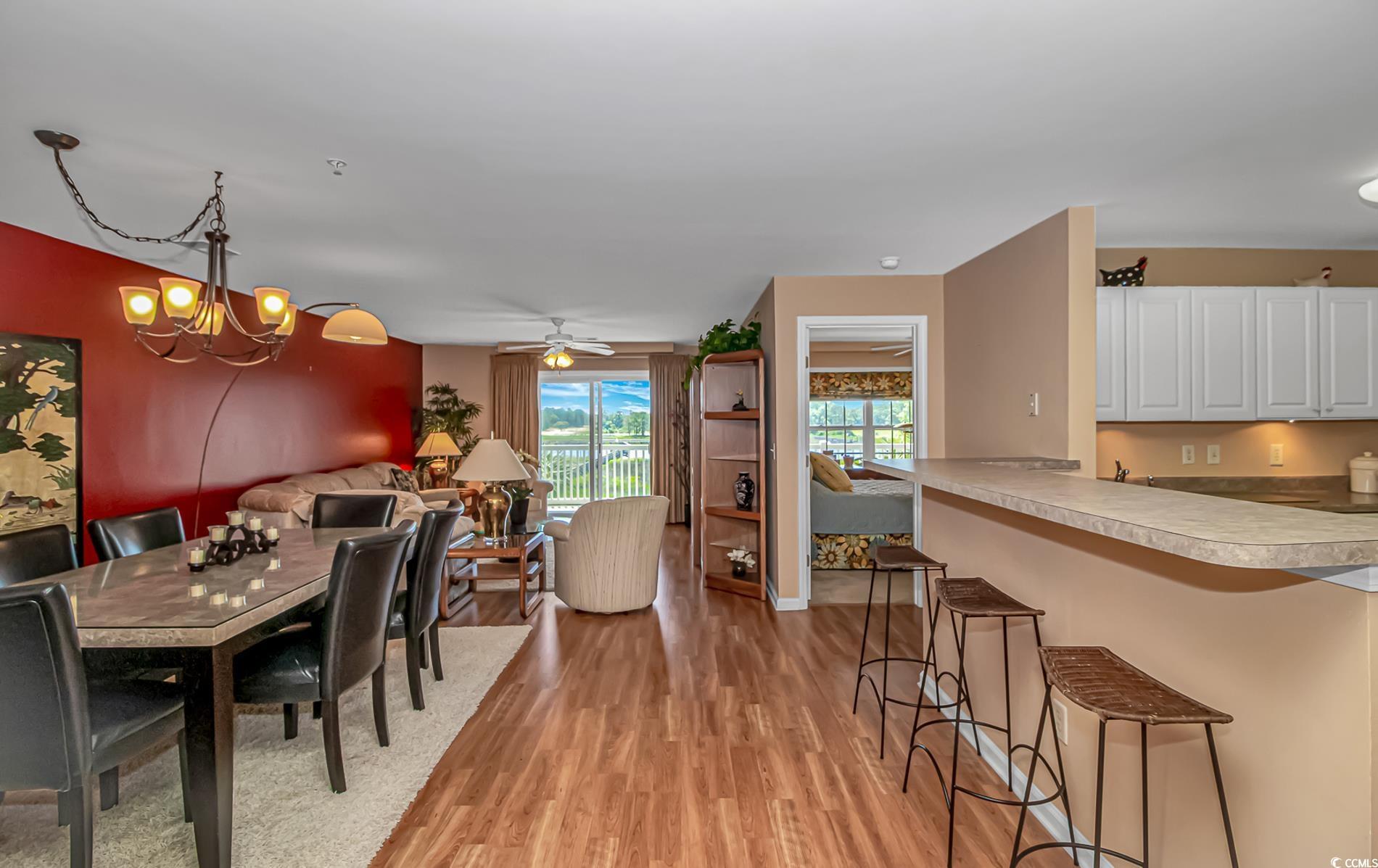 Image 2: Dining space with light wood finished floors and a Image 2: Dining space with light wood finished floors and a