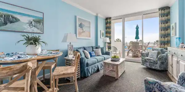 Image 4: Carpeted living room with expansive windows and or Image 4: Carpeted living room with expansive windows and or