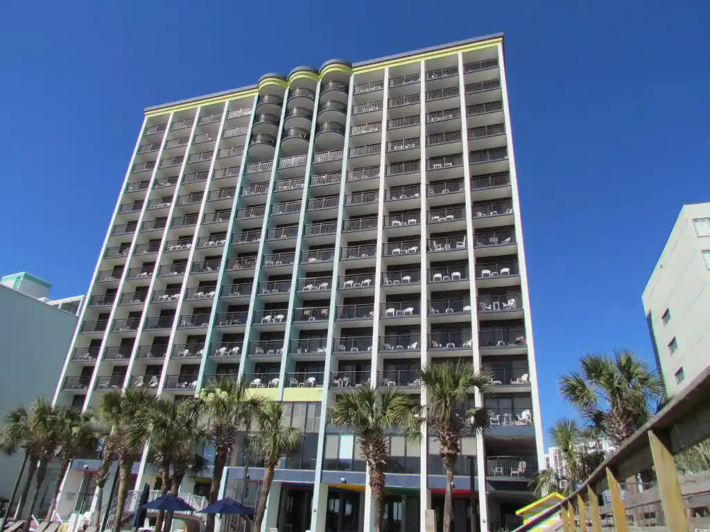 Image 1: View of apartment building / complex