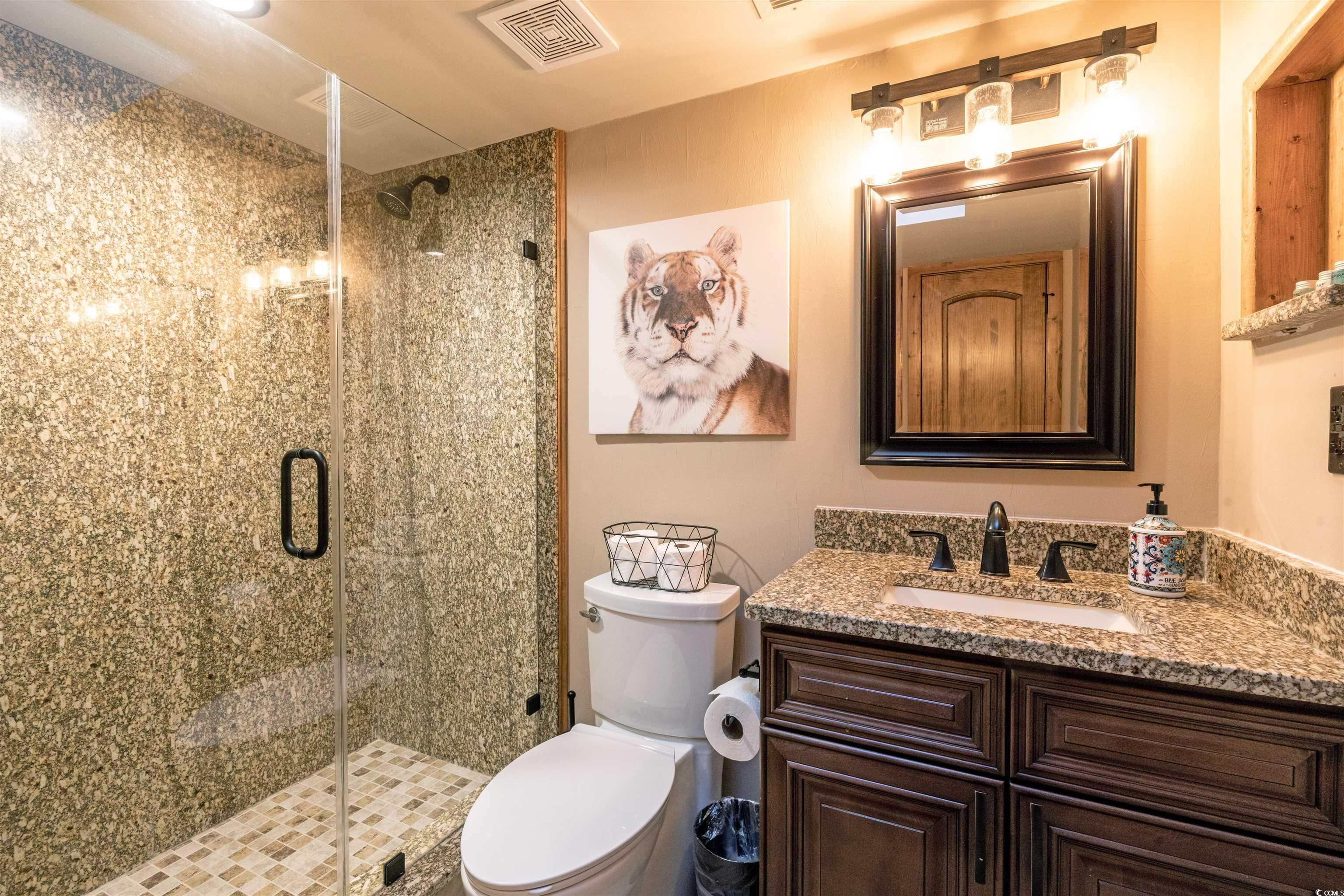 Image 4: Full bath with a stall shower and vanity Image 4: Full bath with a stall shower and vanity