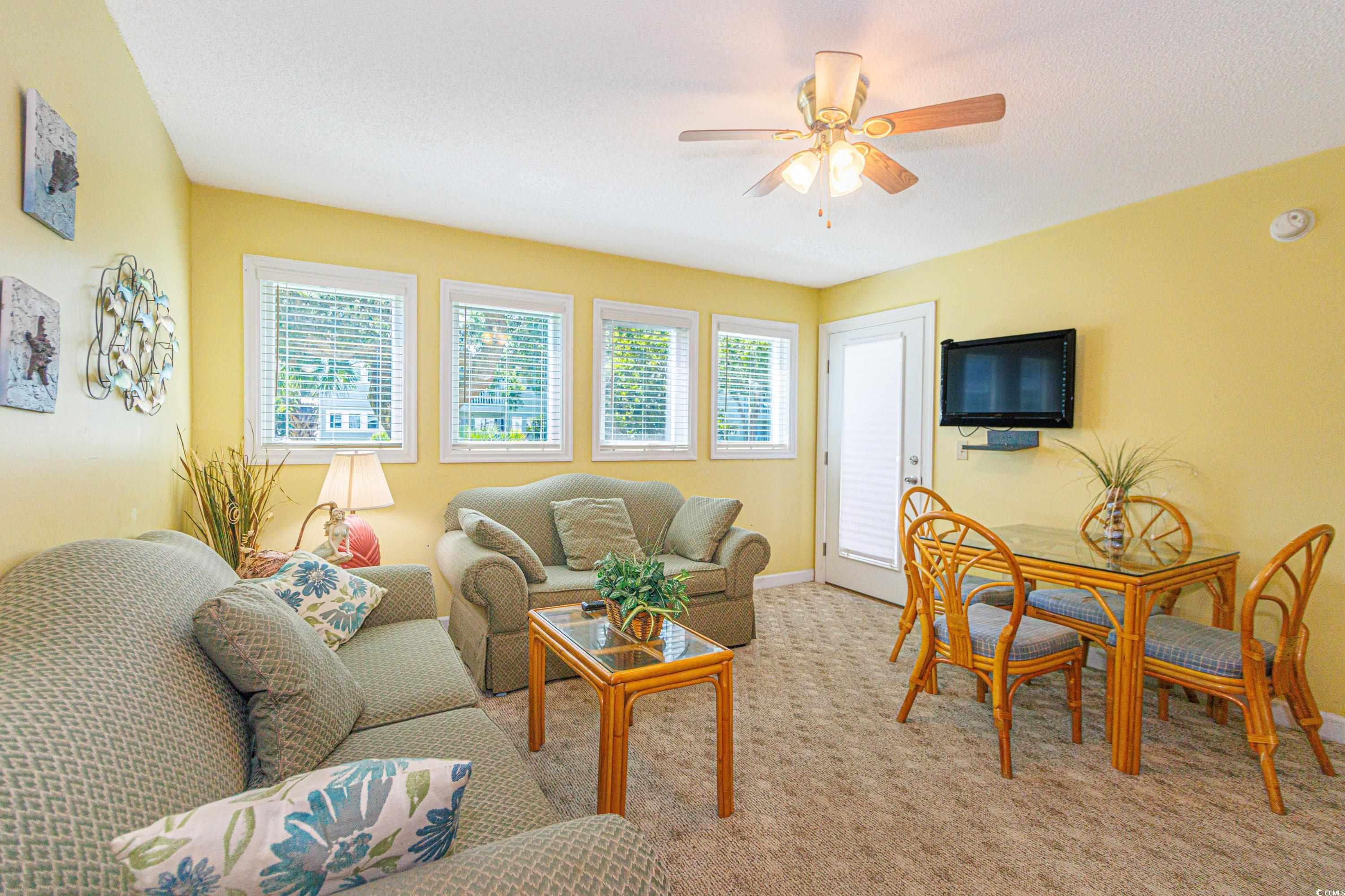 Image 4: Carpeted living room featuring baseboards and ceil Image 4: Carpeted living room featuring baseboards and ceil