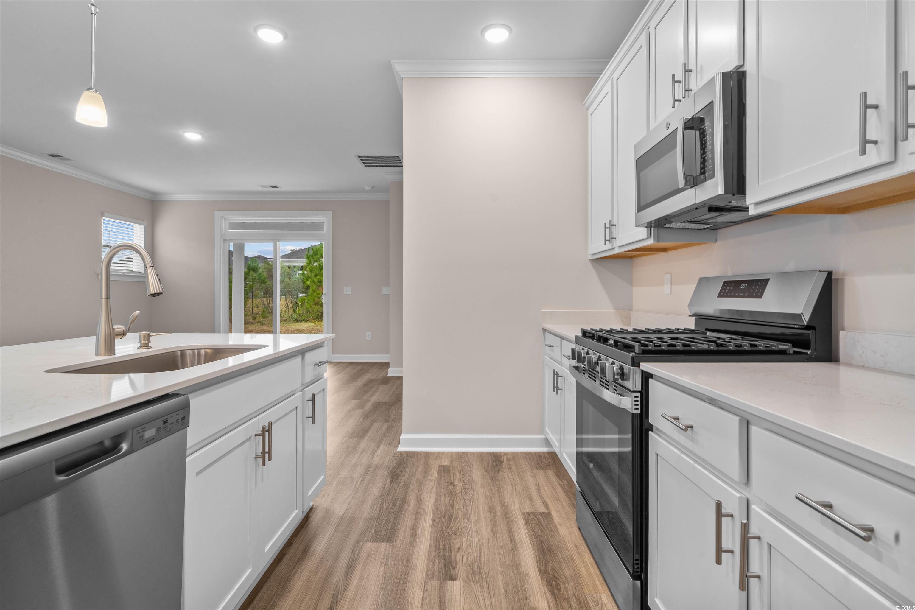 Image 2: Kitchen with appliances with stainless steel finis