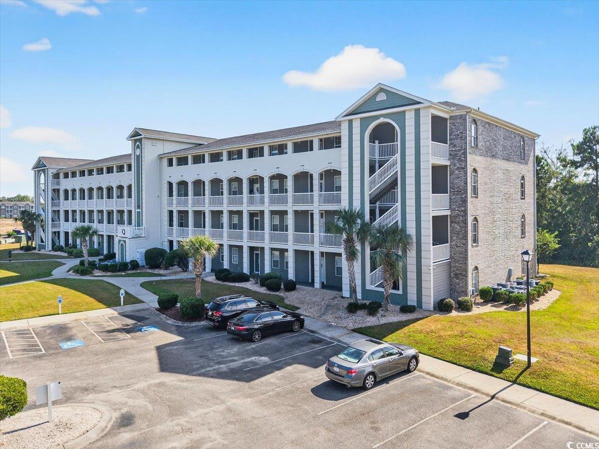 Image 1: View of apartment building / complex featuring unc