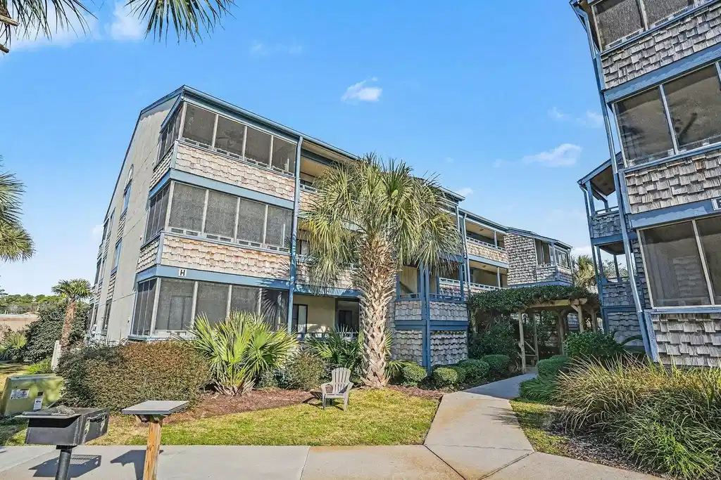 Image 1: View of apartment building / complex
