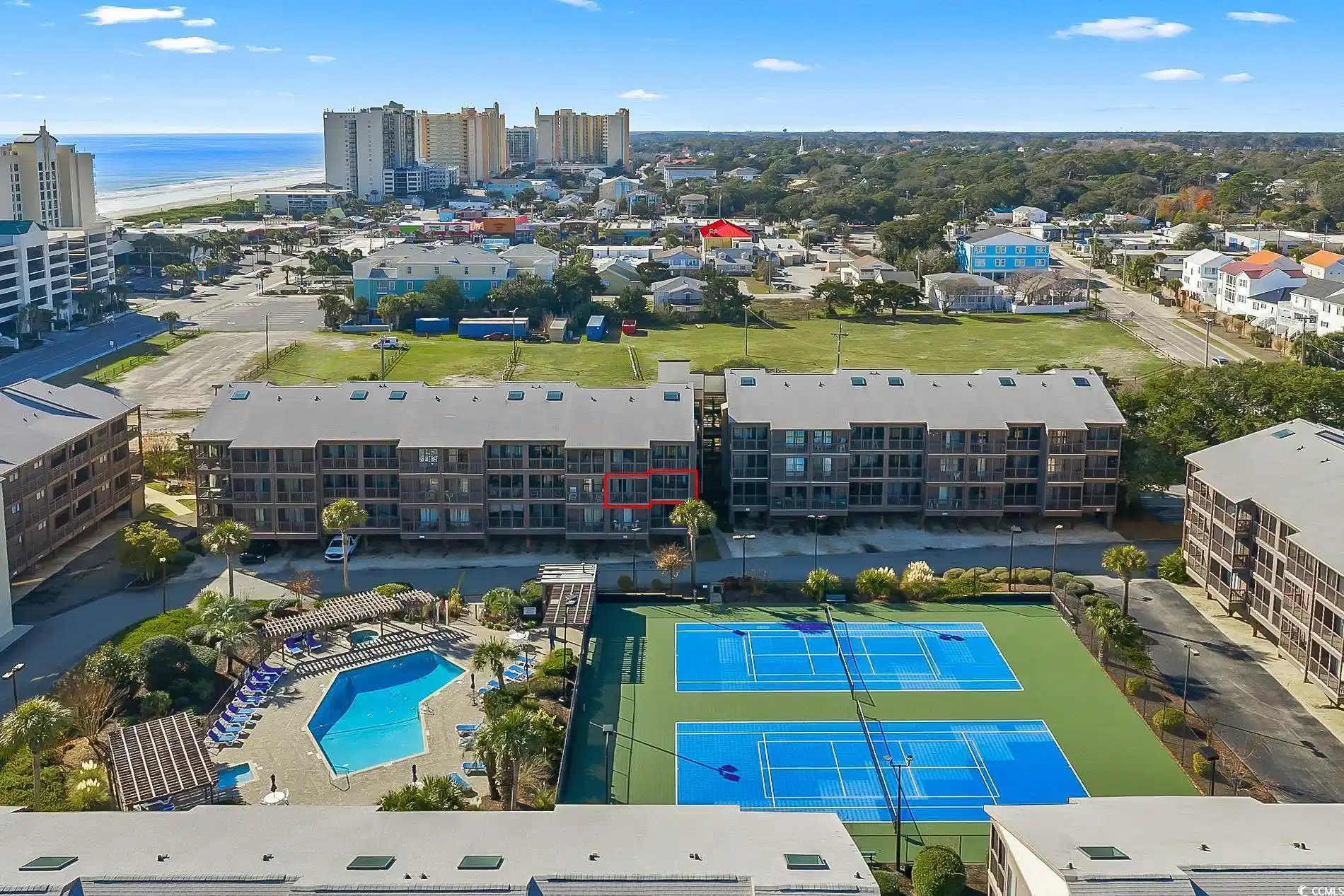 Image 1: View of urban area with a pool and a nearby body o Image 1: View of urban area with a pool and a nearby body o