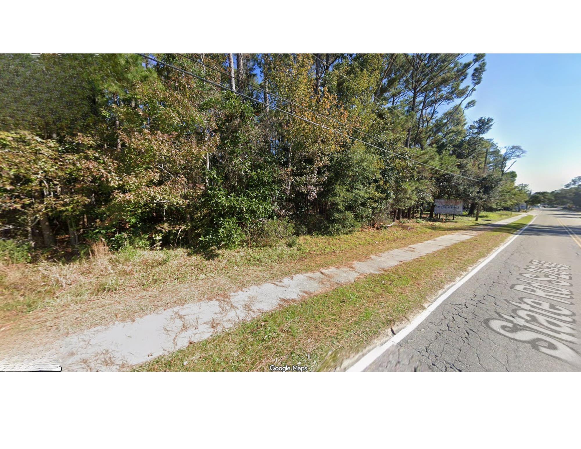 Image 3: View of asphalt road with sidewalks and view of sc