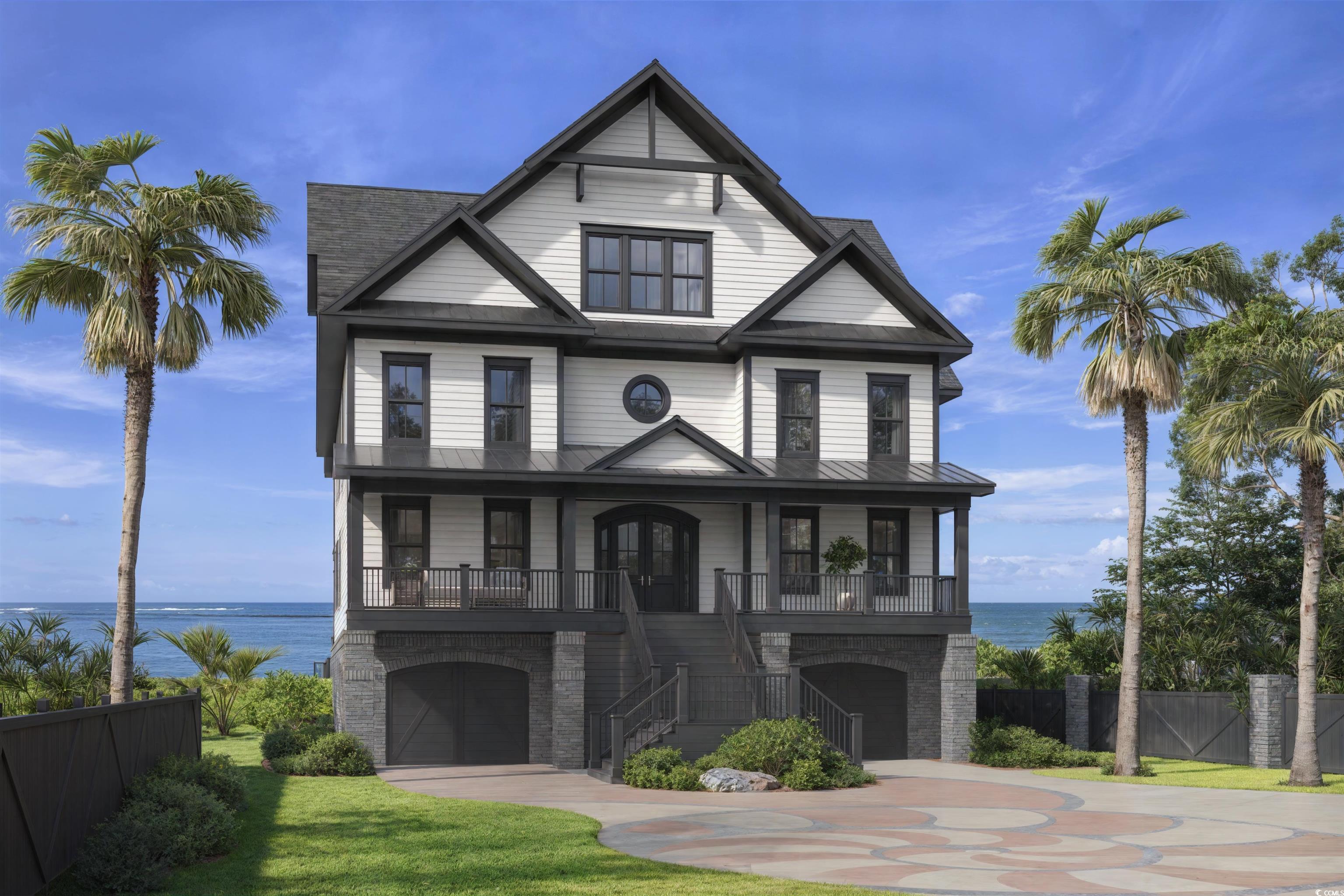 Image 1: View of front of property with stairs, a water vie Image 1: View of front of property with stairs, a water vie