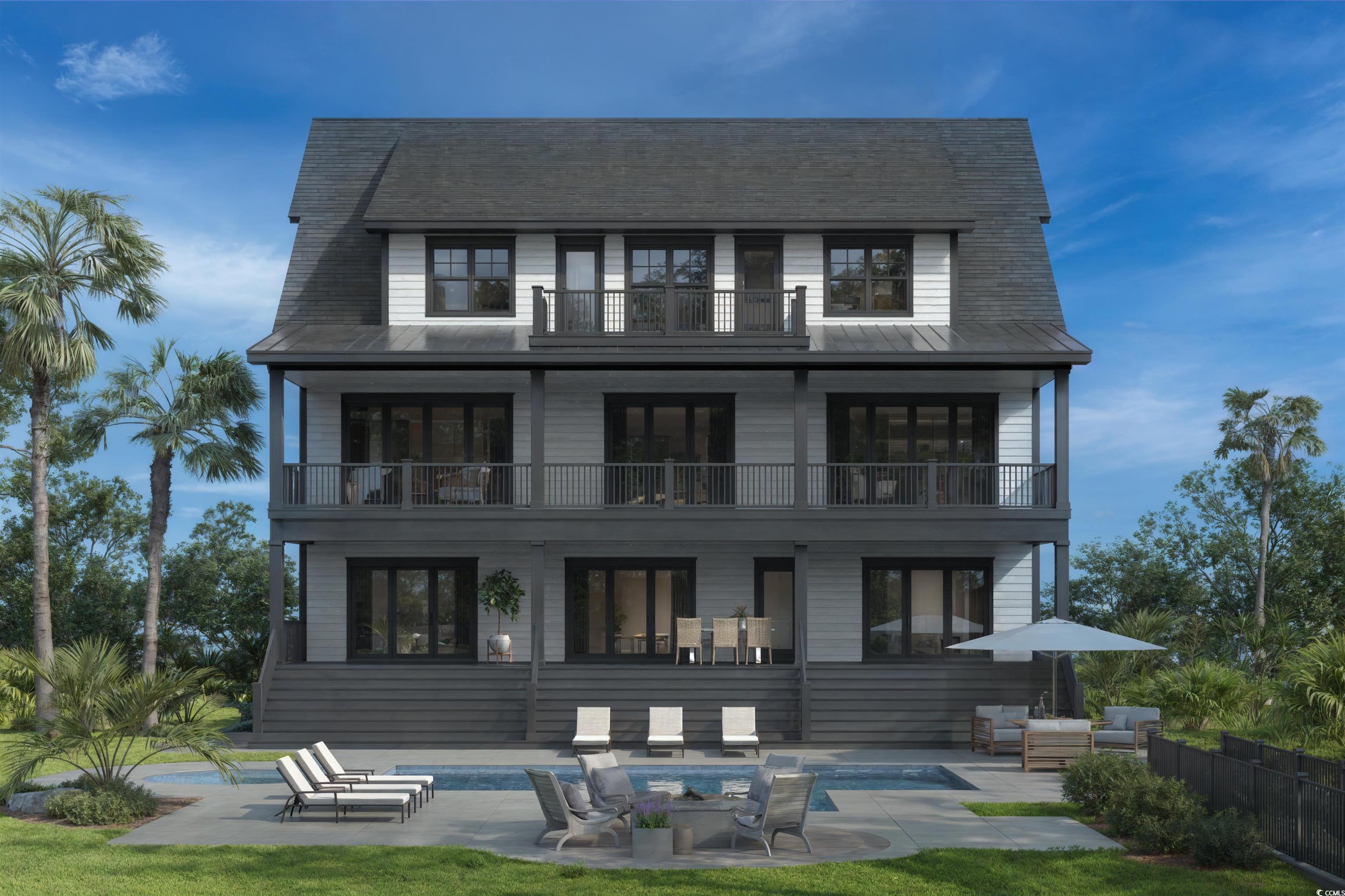 Image 2: Rear view of property featuring a patio area, a ba Image 2: Rear view of property featuring a patio area, a ba