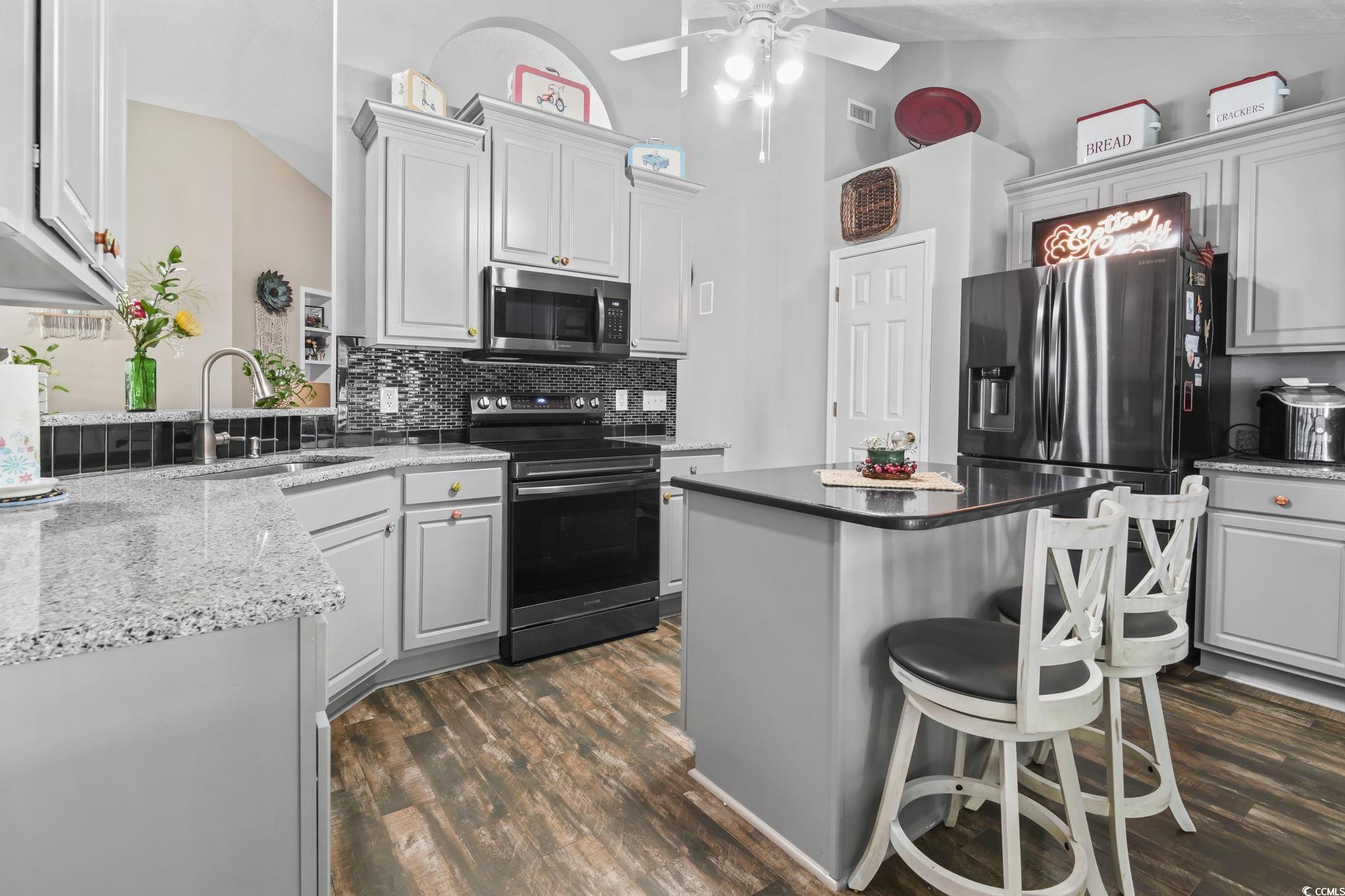 Image 4: Kitchen featuring stainless steel appliances, a br Image 4: Kitchen featuring stainless steel appliances, a br