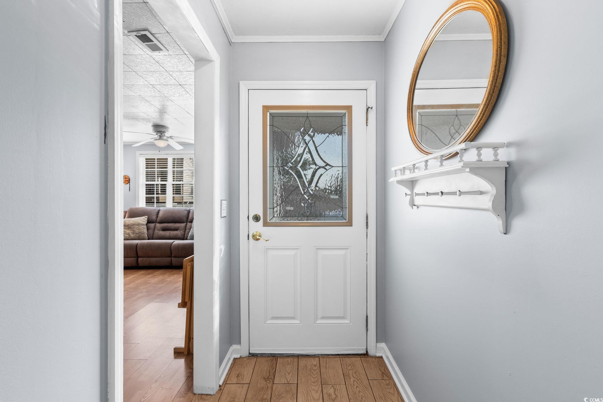 Image 4: Doorway with wood finished floors and ceiling fan Image 4: Doorway with wood finished floors and ceiling fan