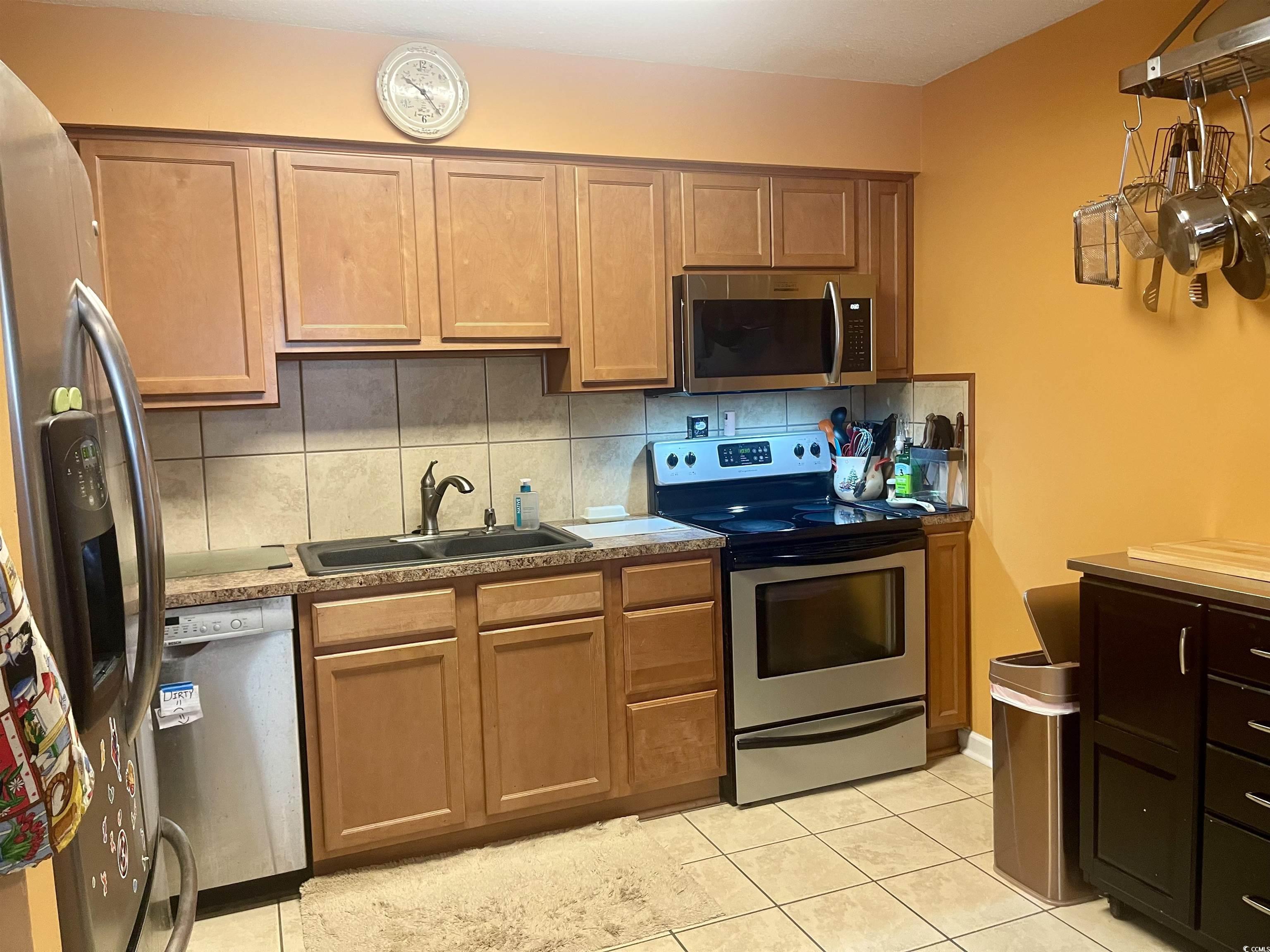 Image 4: Kitchen featuring appliances with stainless steel