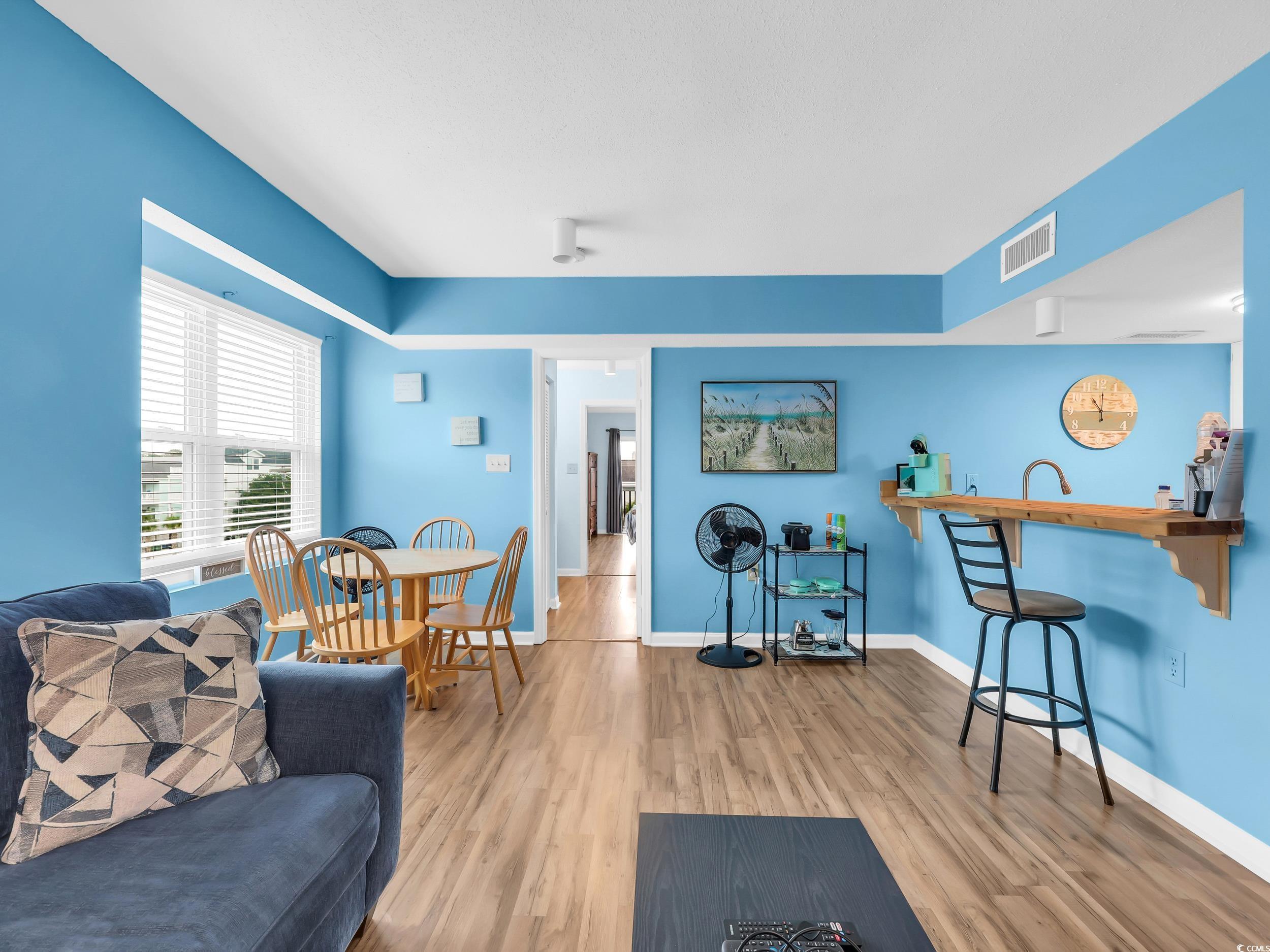 Image 3: Living room with light wood-style flooring and bas Image 3: Living room with light wood-style flooring and bas