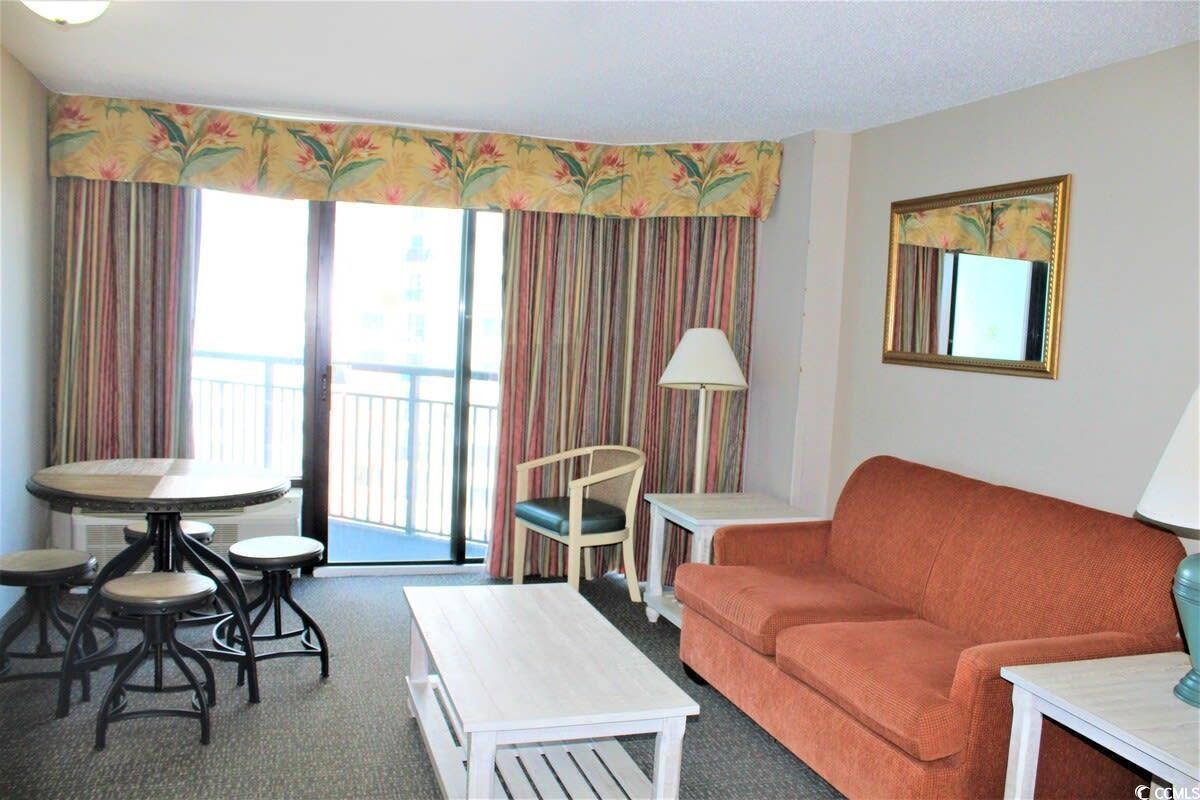 Image 2: Living room featuring carpet flooring