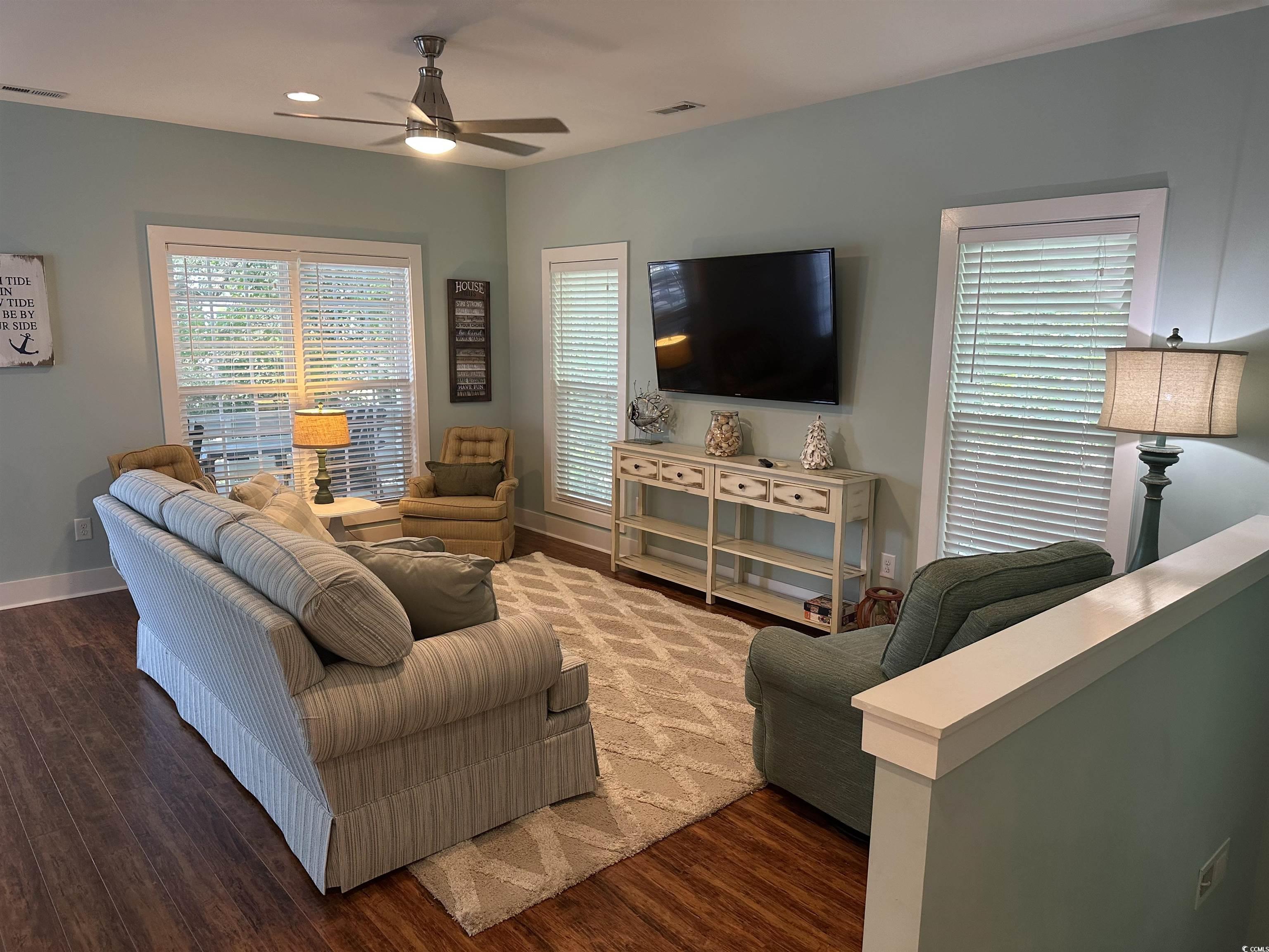 Image 2: Living area with dark wood-type flooring, plenty o Image 2: Living area with dark wood-type flooring, plenty o