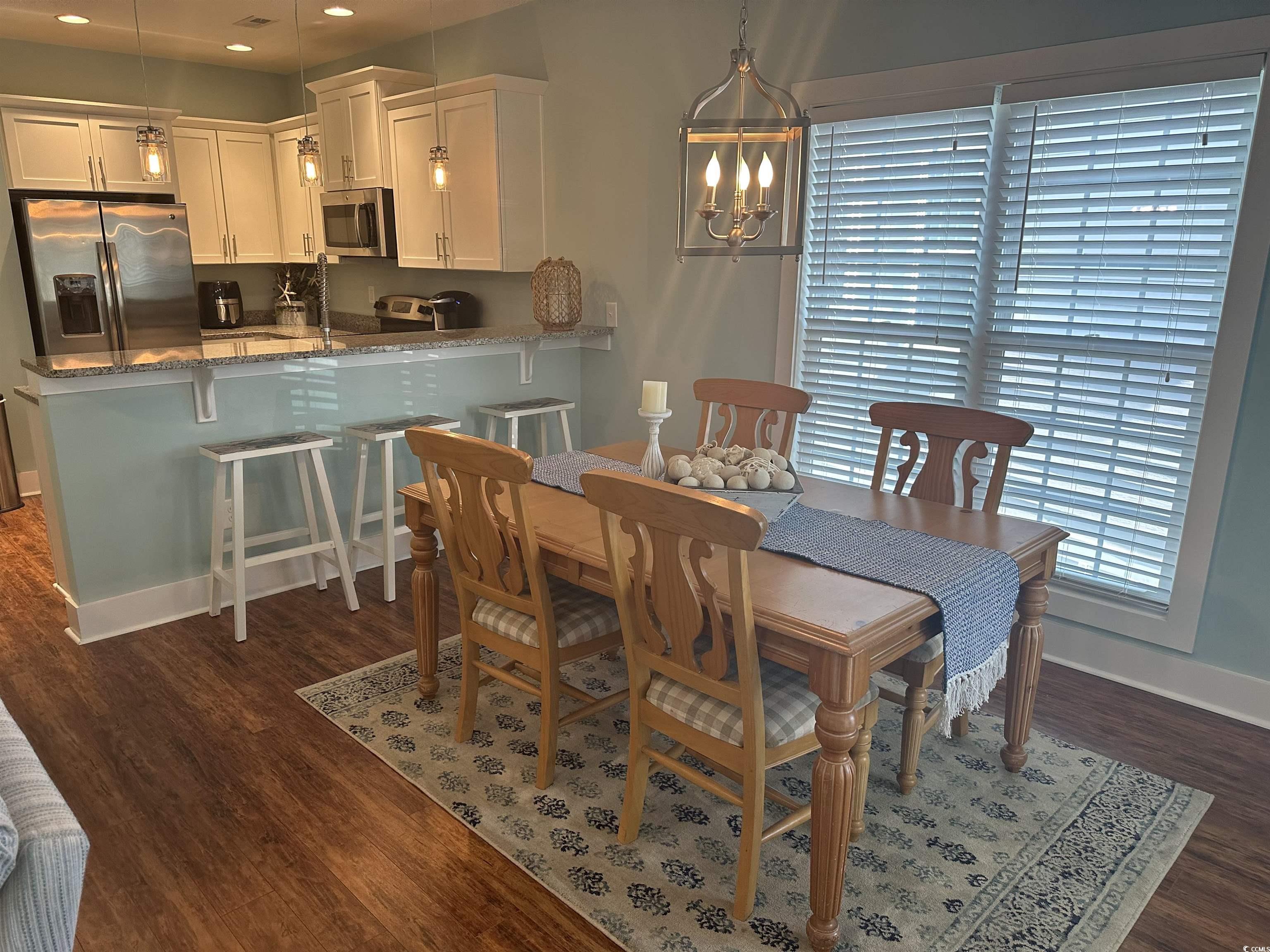 Image 4: Dining area featuring recessed lighting, a chandel Image 4: Dining area featuring recessed lighting, a chandel