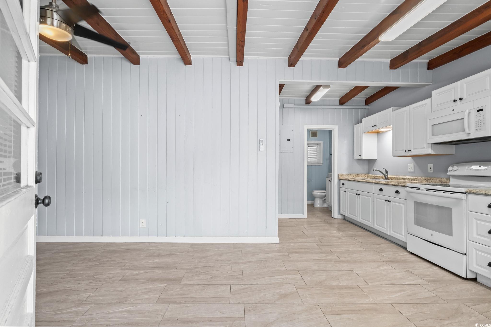 Image 4: Kitchen featuring white appliances, white cabinets