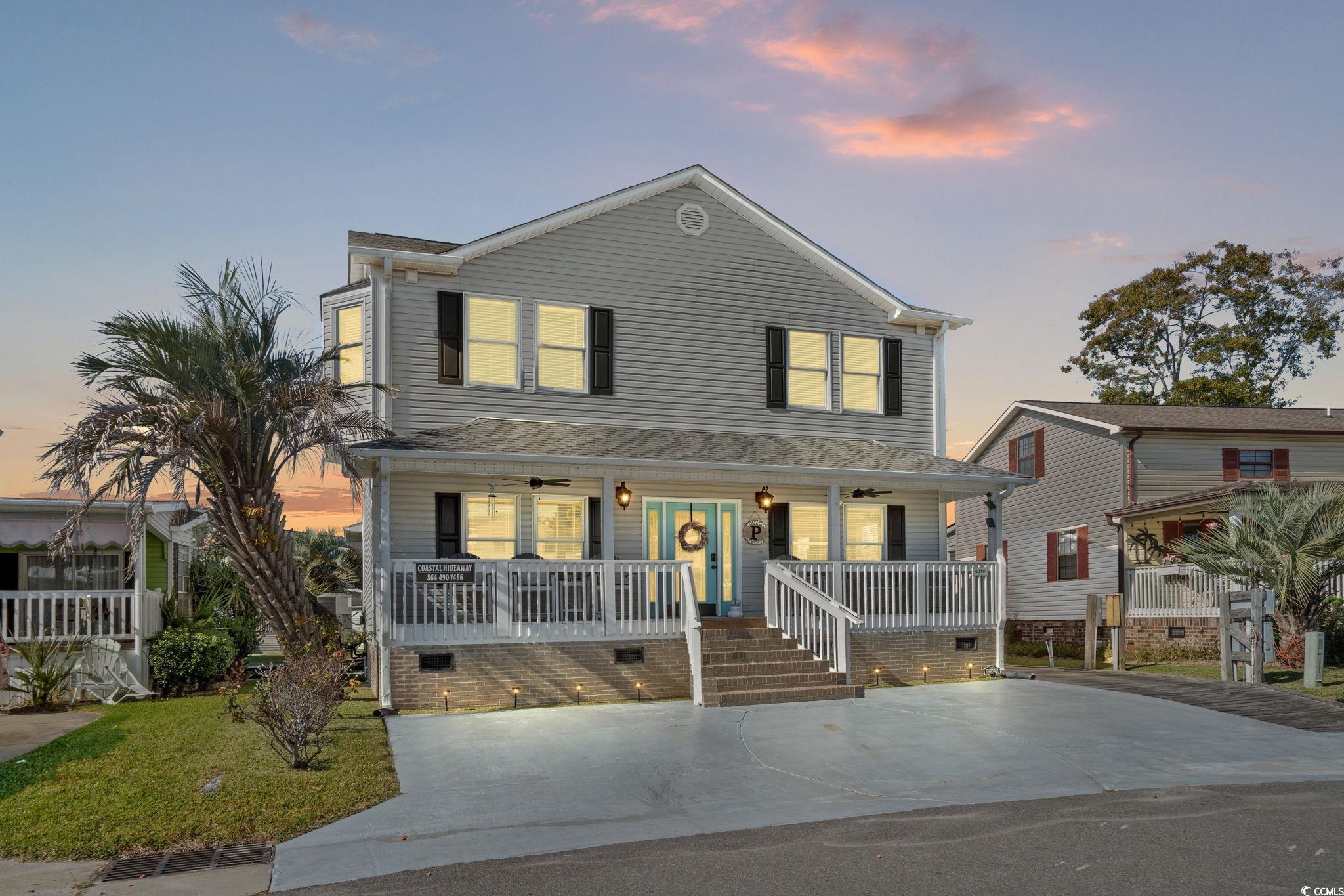 Image 1: View of front of house featuring covered porch, a Image 1: View of front of house featuring covered porch, a