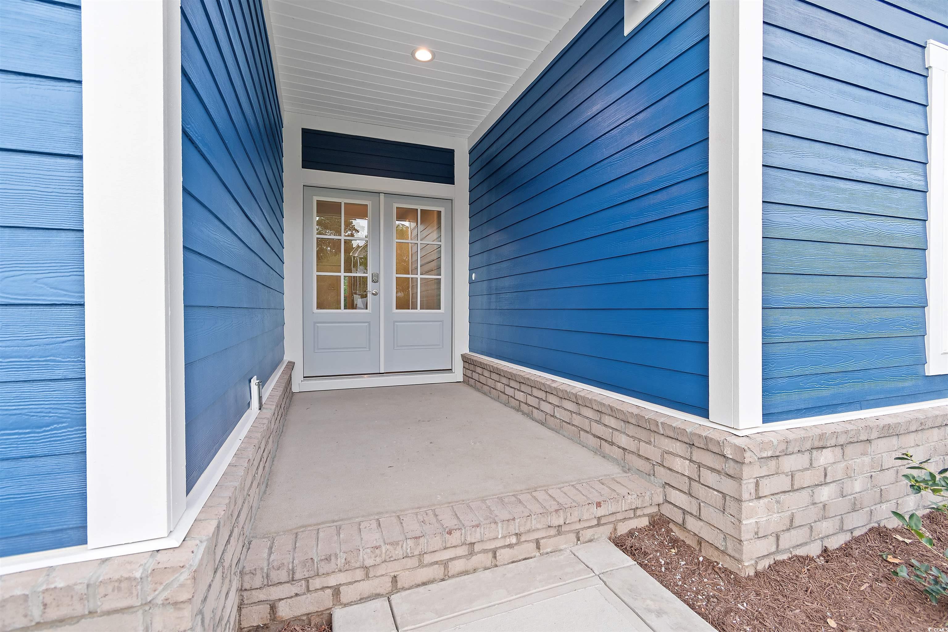 Image 3: Property entrance featuring a porch and french doo Image 3: Property entrance featuring a porch and french doo