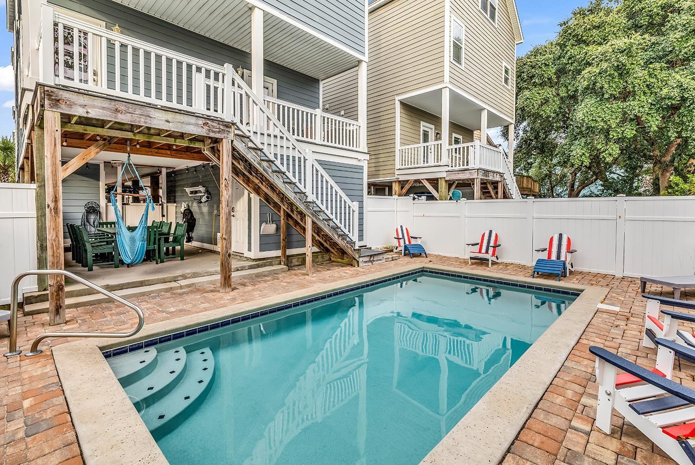 Image 3: View of swimming pool with a patio area, stairs, a