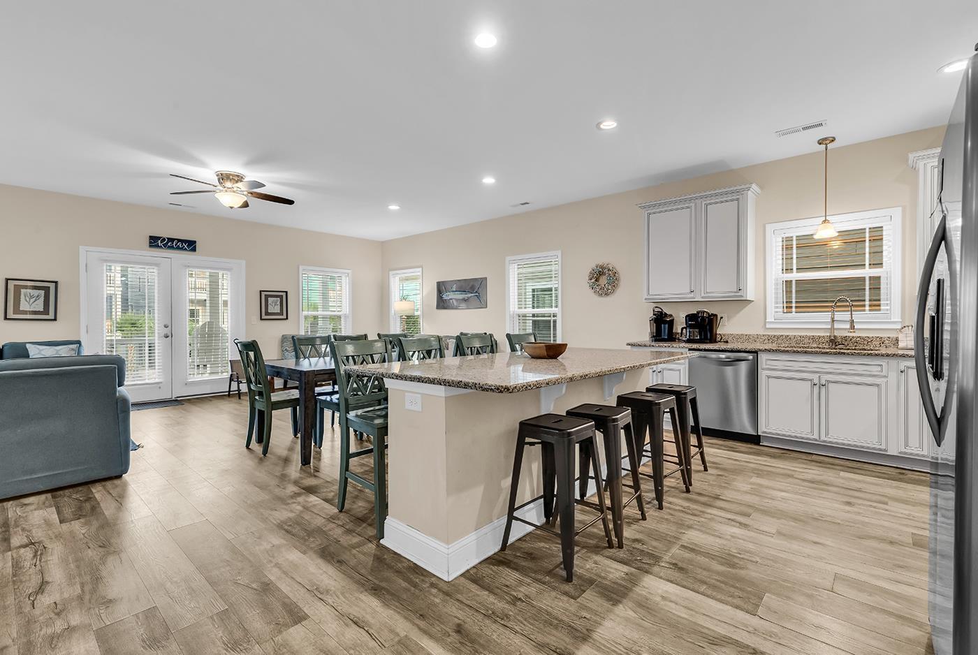 Image 4: Kitchen featuring a kitchen breakfast bar, light s