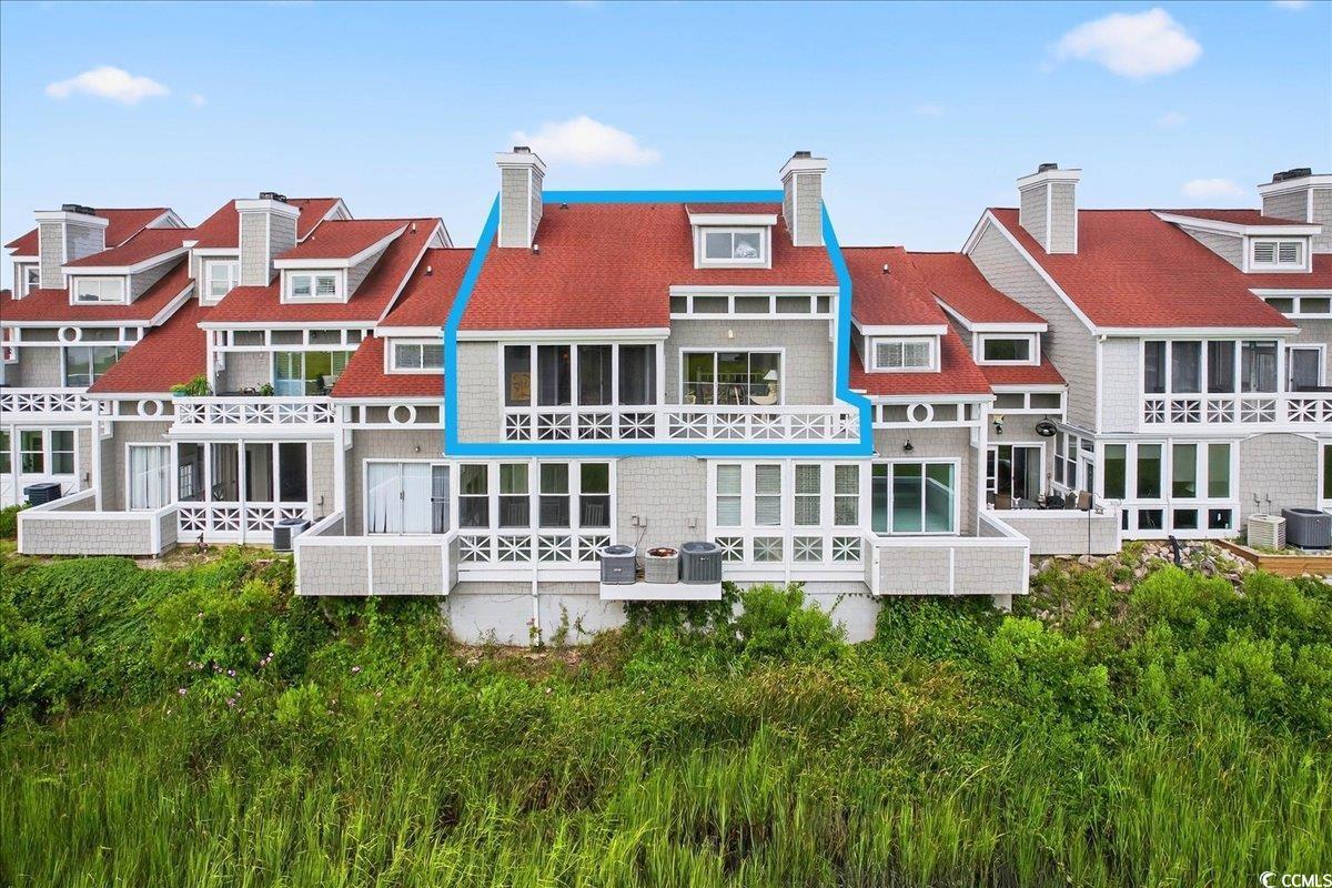 Image 3: Rear view of house with a residential view