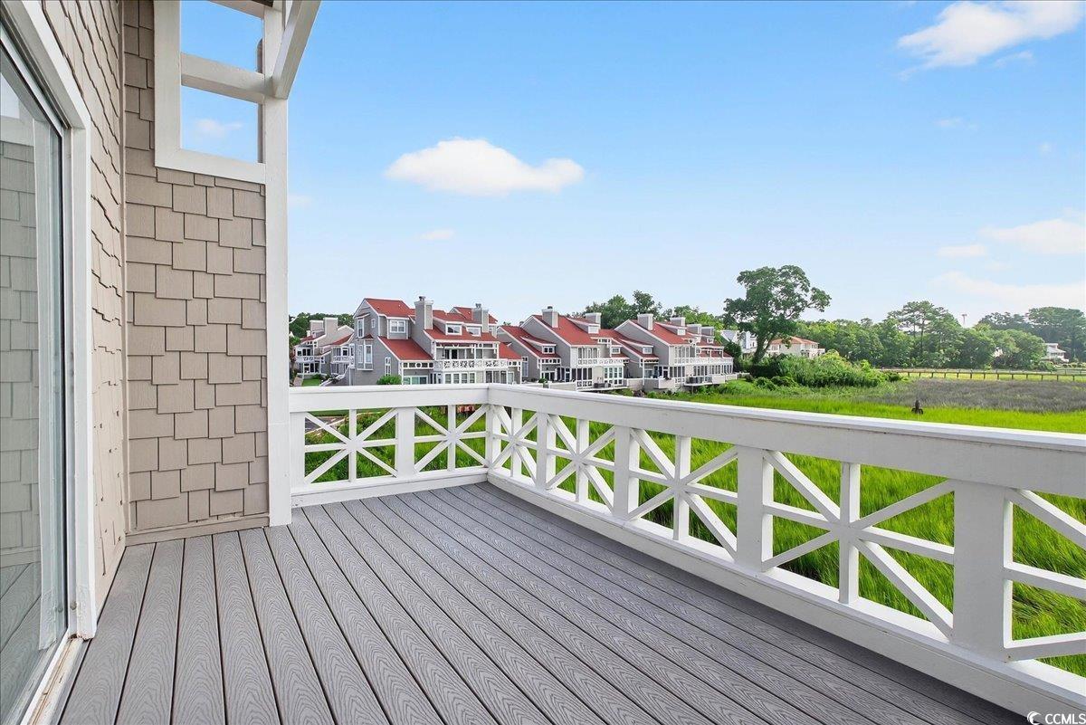 Image 4: Wooden terrace with a residential view