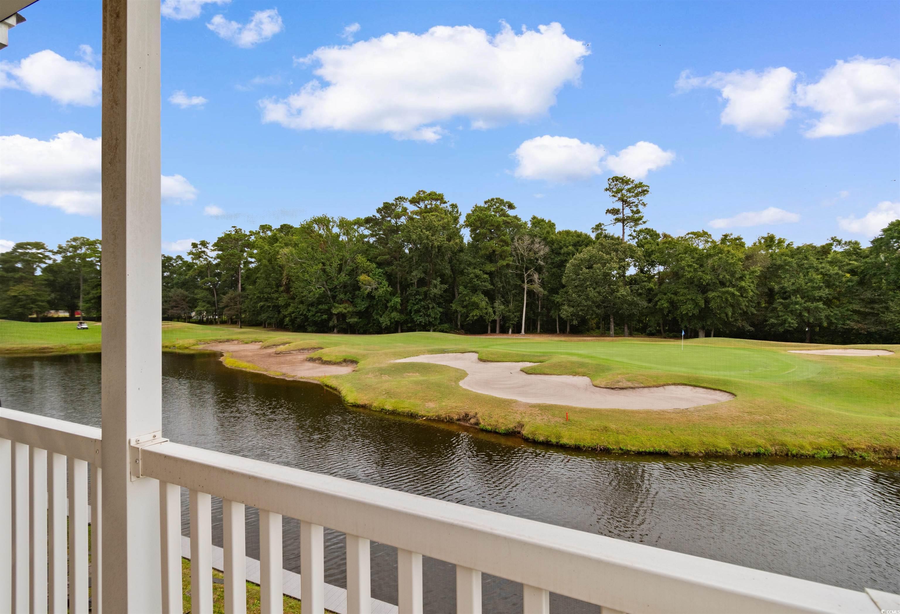 Image 4: Water view featuring a local golf course and a tre