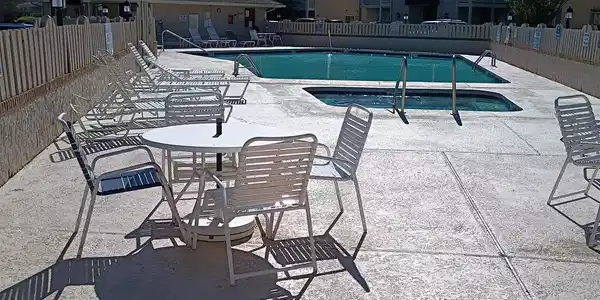 Image 3: Community pool with a patio Image 3: Community pool with a patio