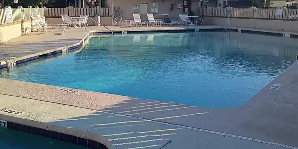 Image 4: Community pool with a patio Image 4: Community pool with a patio