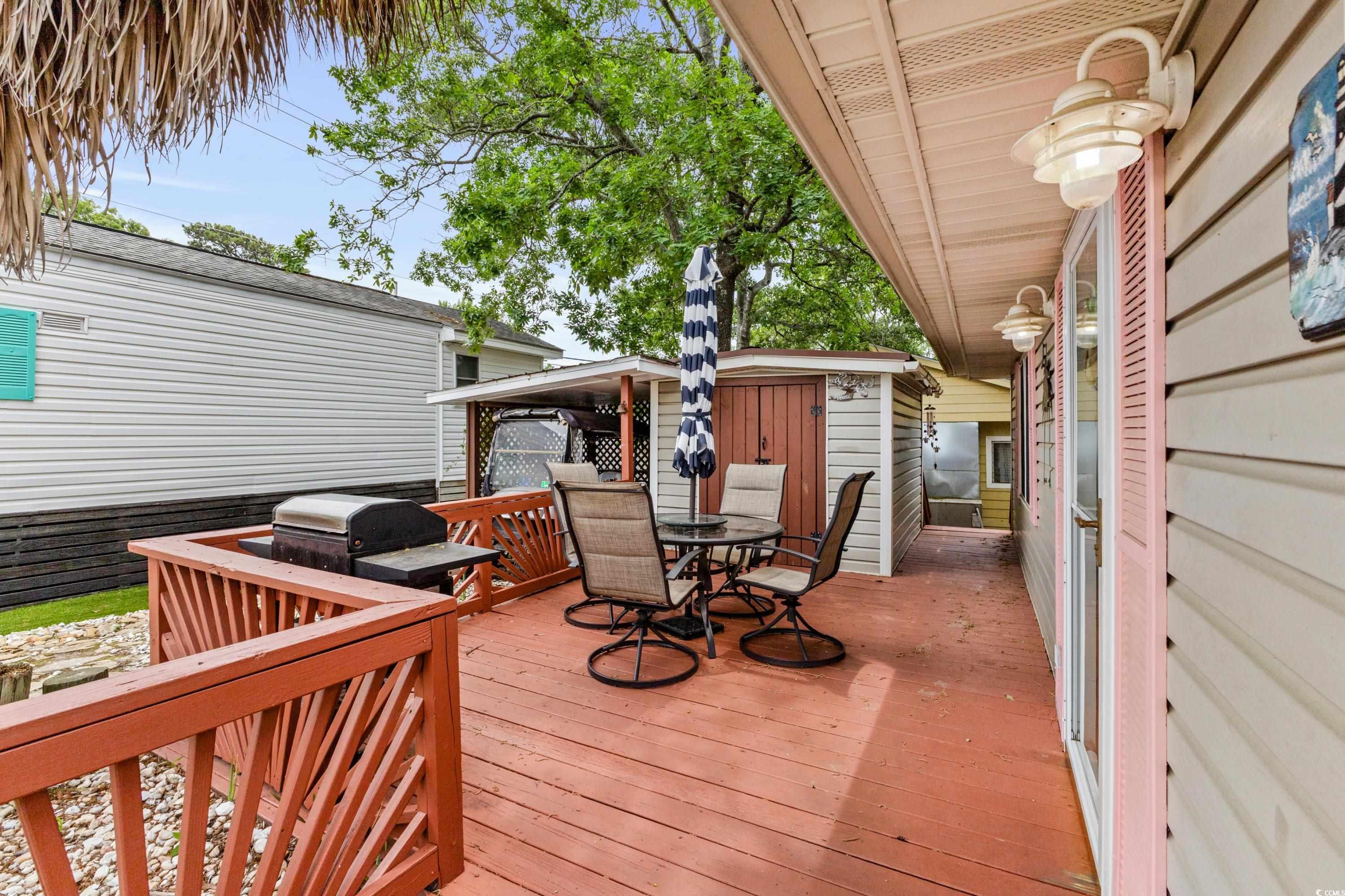 Image 4: Deck with outdoor dining area and area for grillin Image 4: Deck with outdoor dining area and area for grillin