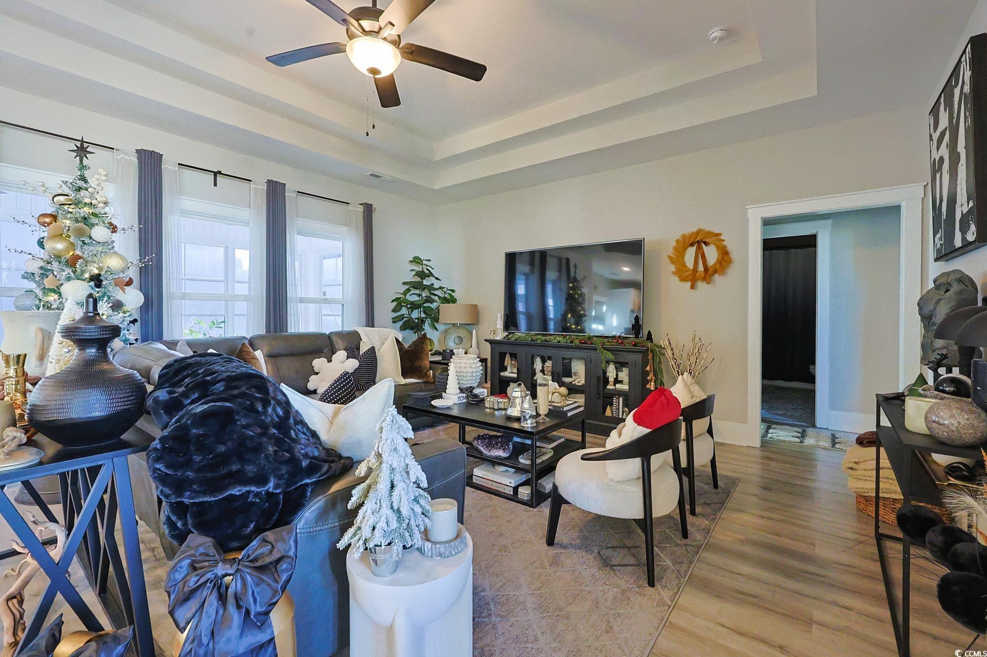 Image 3: Living area featuring a raised ceiling, a ceiling Image 3: Living area featuring a raised ceiling, a ceiling