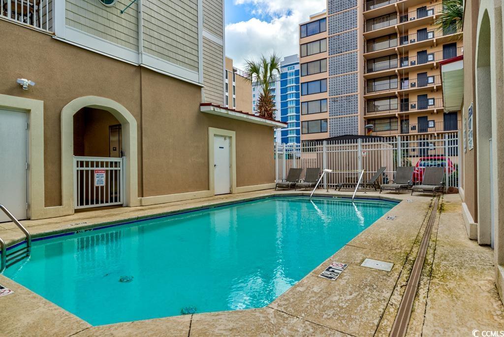 Image 3: Community pool with a patio area Image 3: Community pool with a patio area