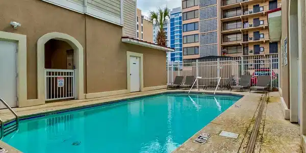 Image 3: Community pool with a patio area Image 3: Community pool with a patio area