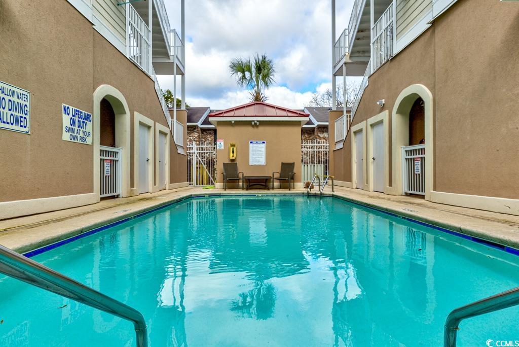 Image 4: Community pool featuring a patio Image 4: Community pool featuring a patio