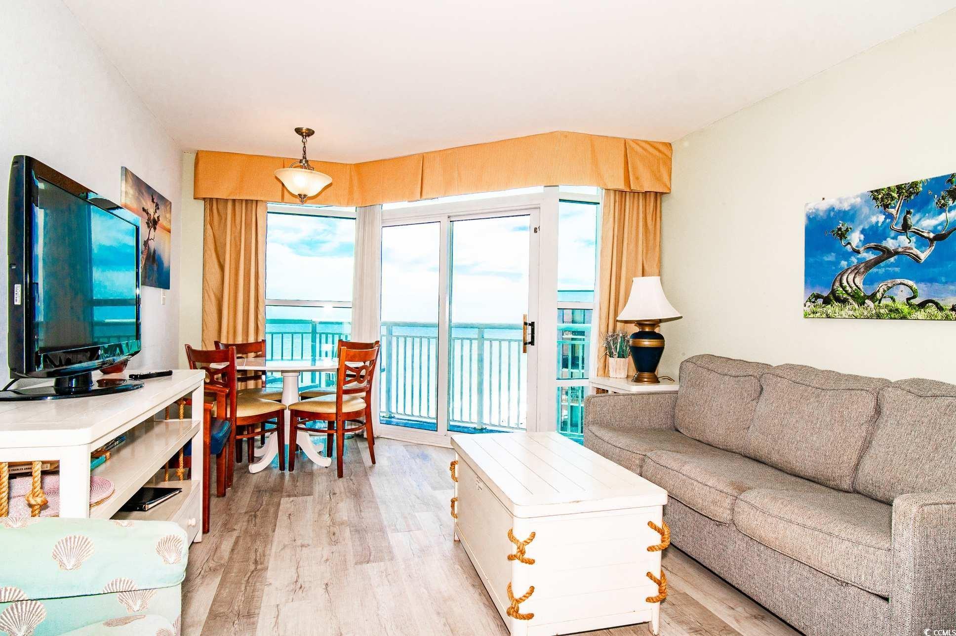 Image 4: Living room featuring light wood-style flooring an