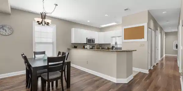 Image 2: Dining area featuring dark wood-style flooring, a Image 2: Dining area featuring dark wood-style flooring, a