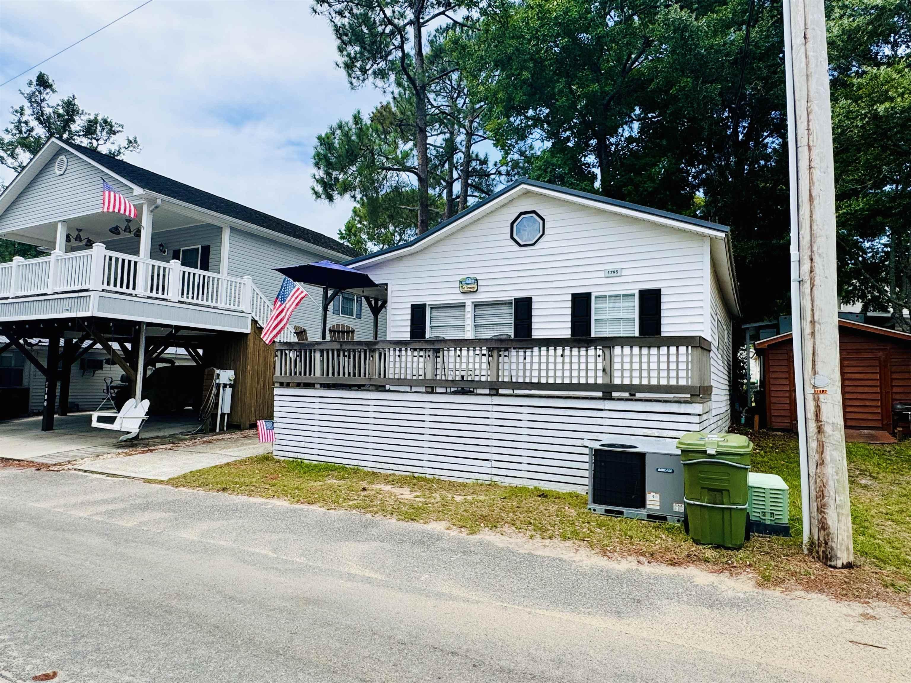 Image 3: View of front of house with central AC unit and a