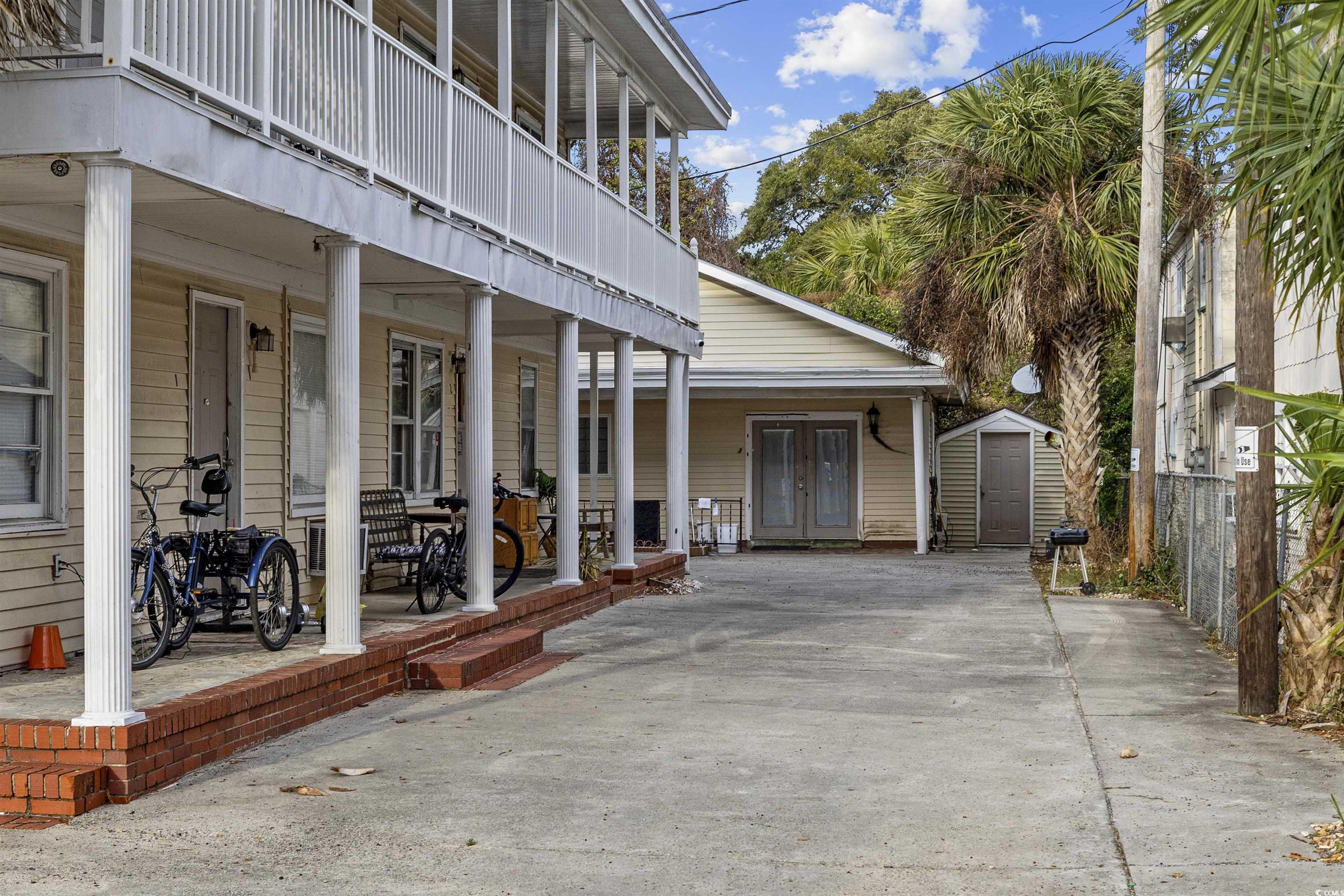 Image 2: View of property exterior featuring a storage shed
