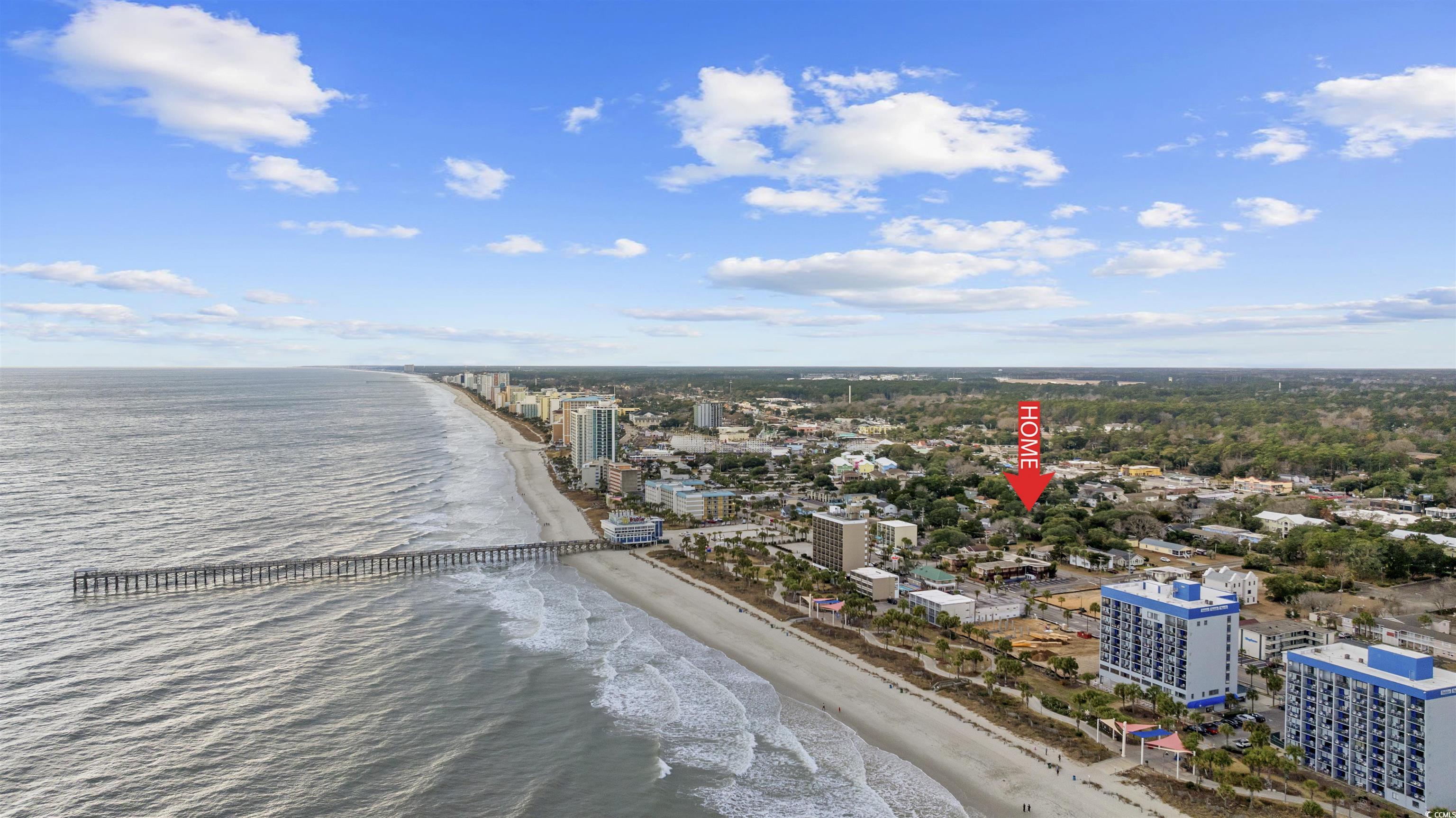 Image 3: View of urban area with waterfront with a beach