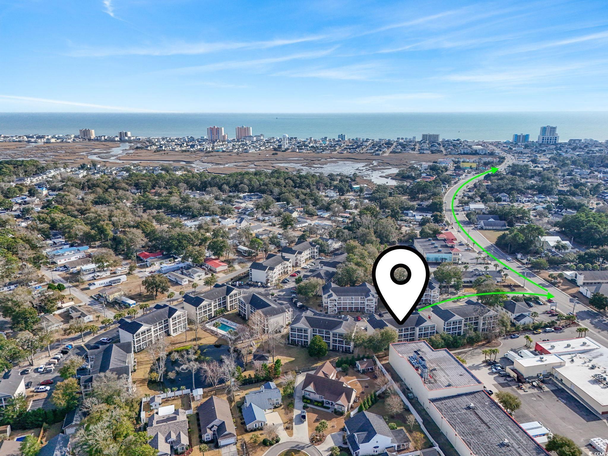 Image 2: Aerial view of property and surrounding area with