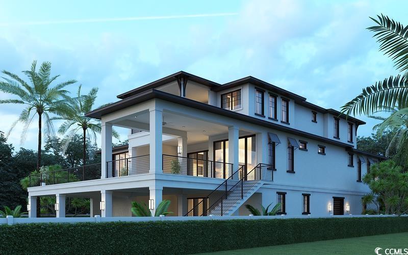 Image 4: Exterior space with a balcony, stairs, and stucco