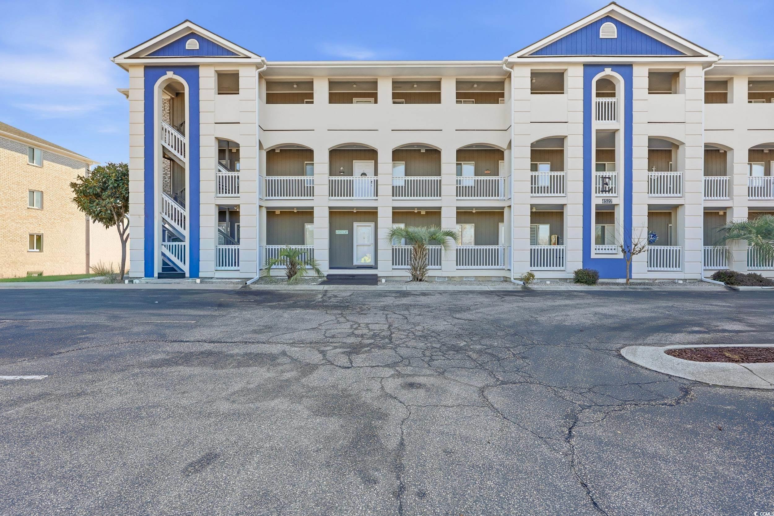 Image 1: View of apartment building / complex