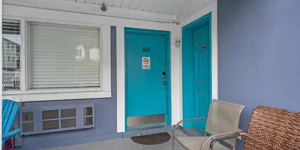 Image 4: Doorway to property with stucco siding