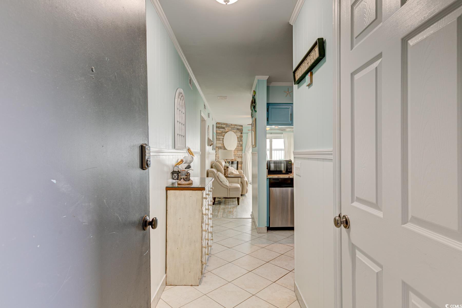 Image 3: Hall with light tile patterned flooring and orname Image 3: Hall with light tile patterned flooring and orname