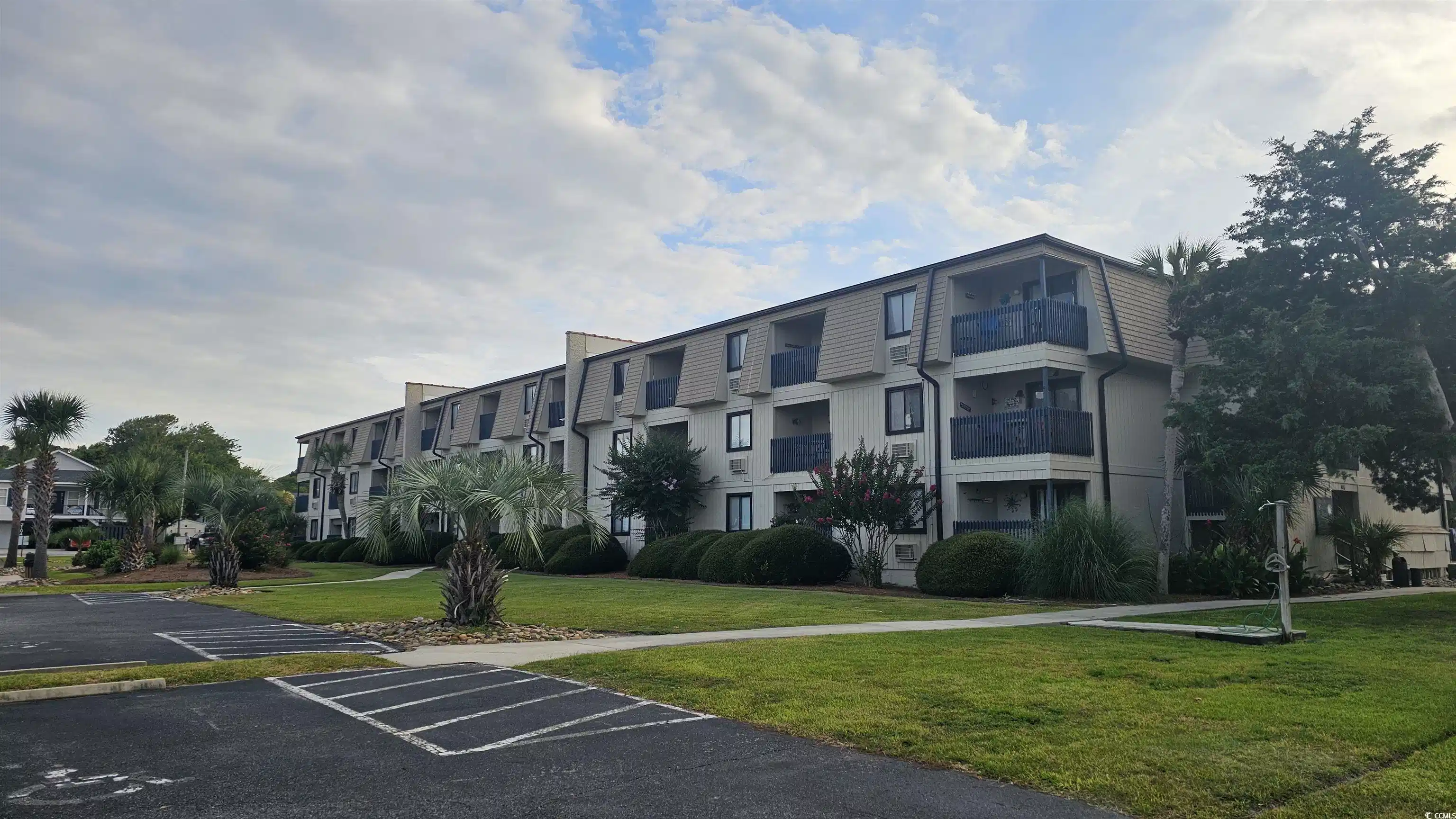 Image 1: View of property with uncovered parking and a resi