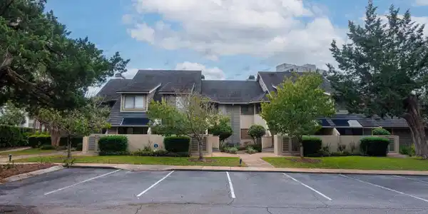 Image 2: View of building exterior featuring stairway and u