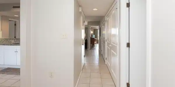 Image 3: Hallway with light tile patterned floors and reces