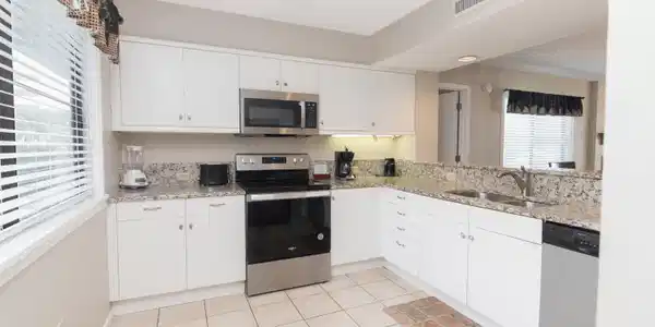 Image 4: Kitchen featuring stainless steel appliances, whit