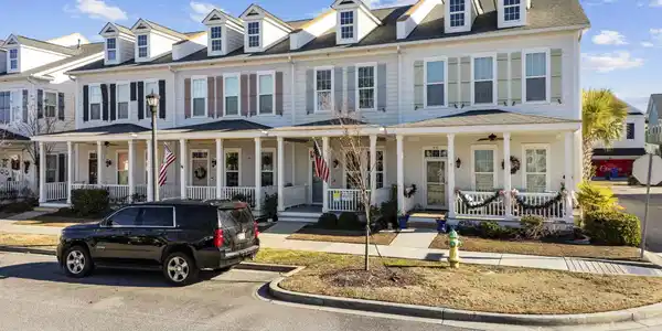 Image 2: View of front of home featuring a porch and a shin Image 2: View of front of home featuring a porch and a shin