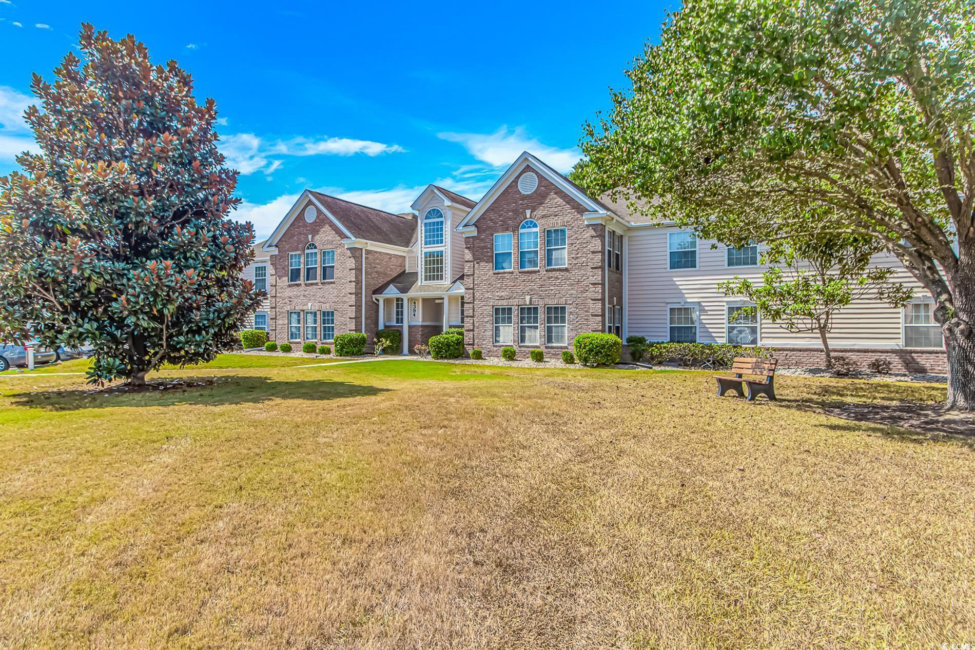 Image 1: View of front of property featuring a front lawn a Image 1: View of front of property featuring a front lawn a